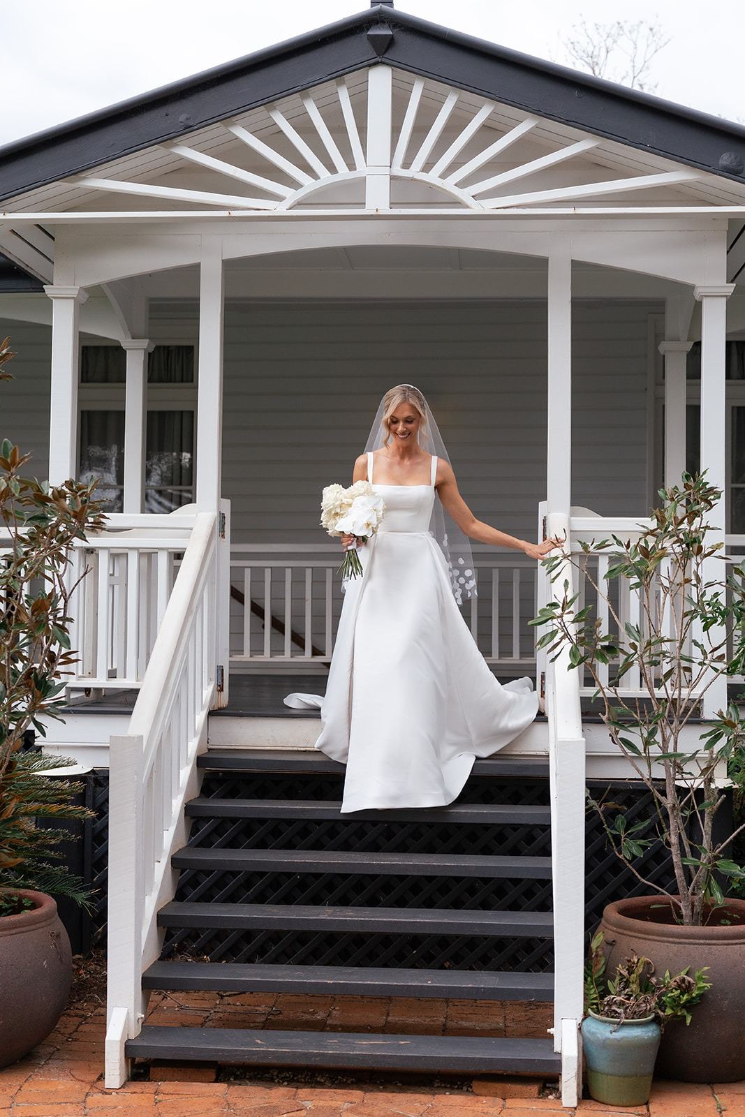A bride on the homestead steps