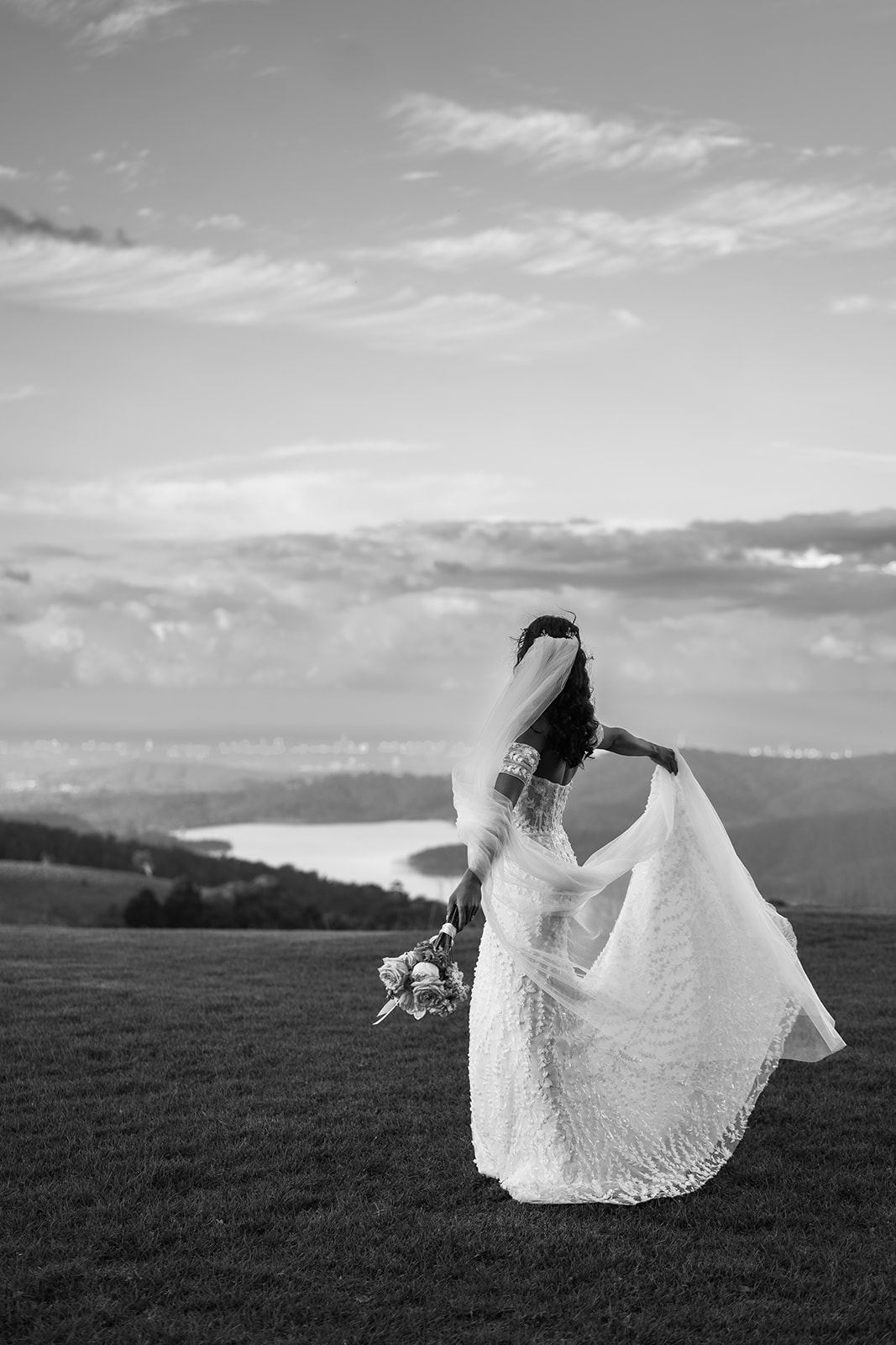 Bride on the edge of the mountain overlooking the coast