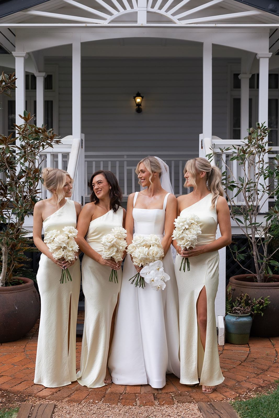 Bride and bridesmaids on the homestead steps