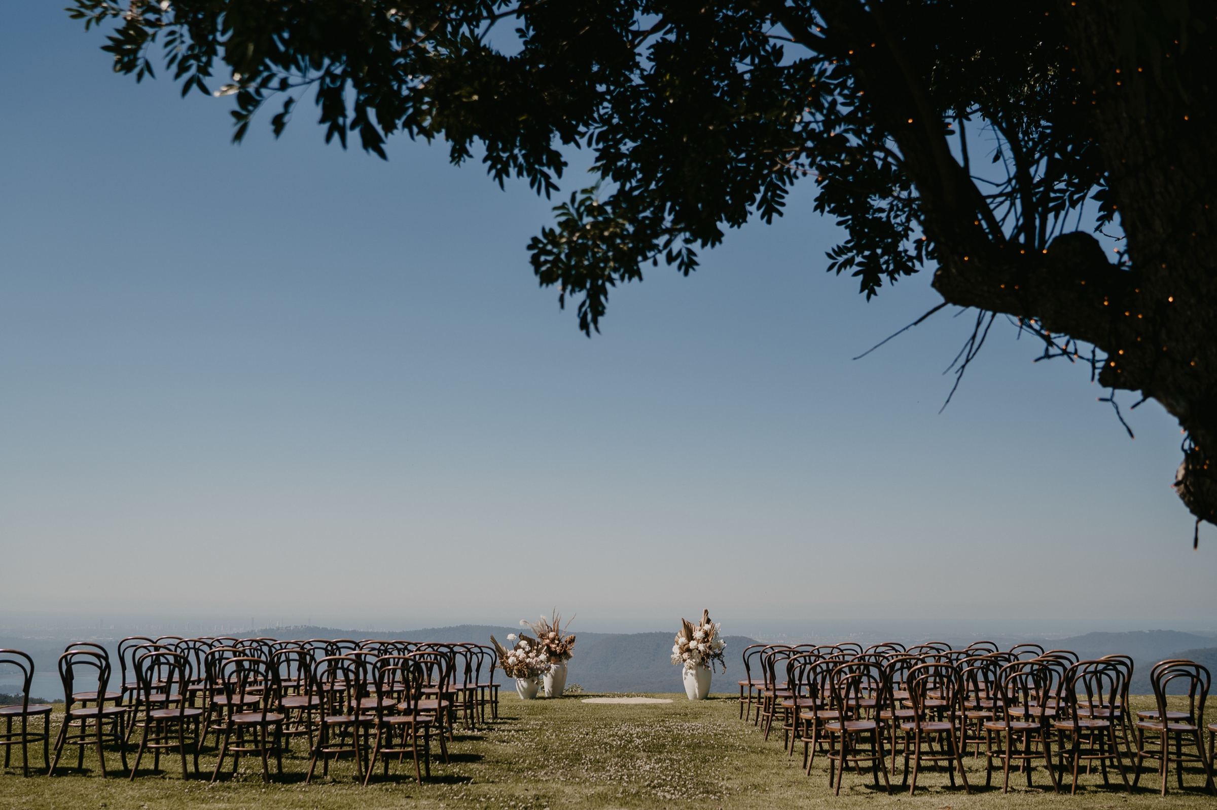 Ceremony at Rosewood Estate with the coast as a backdrop
