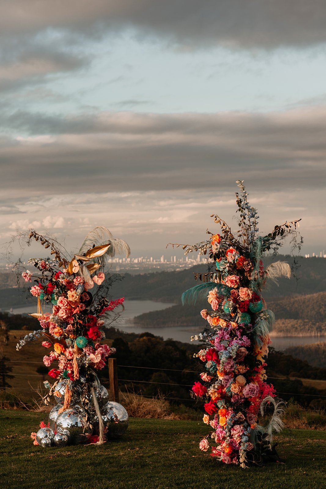 Floral ceremony pillars framing the valley view