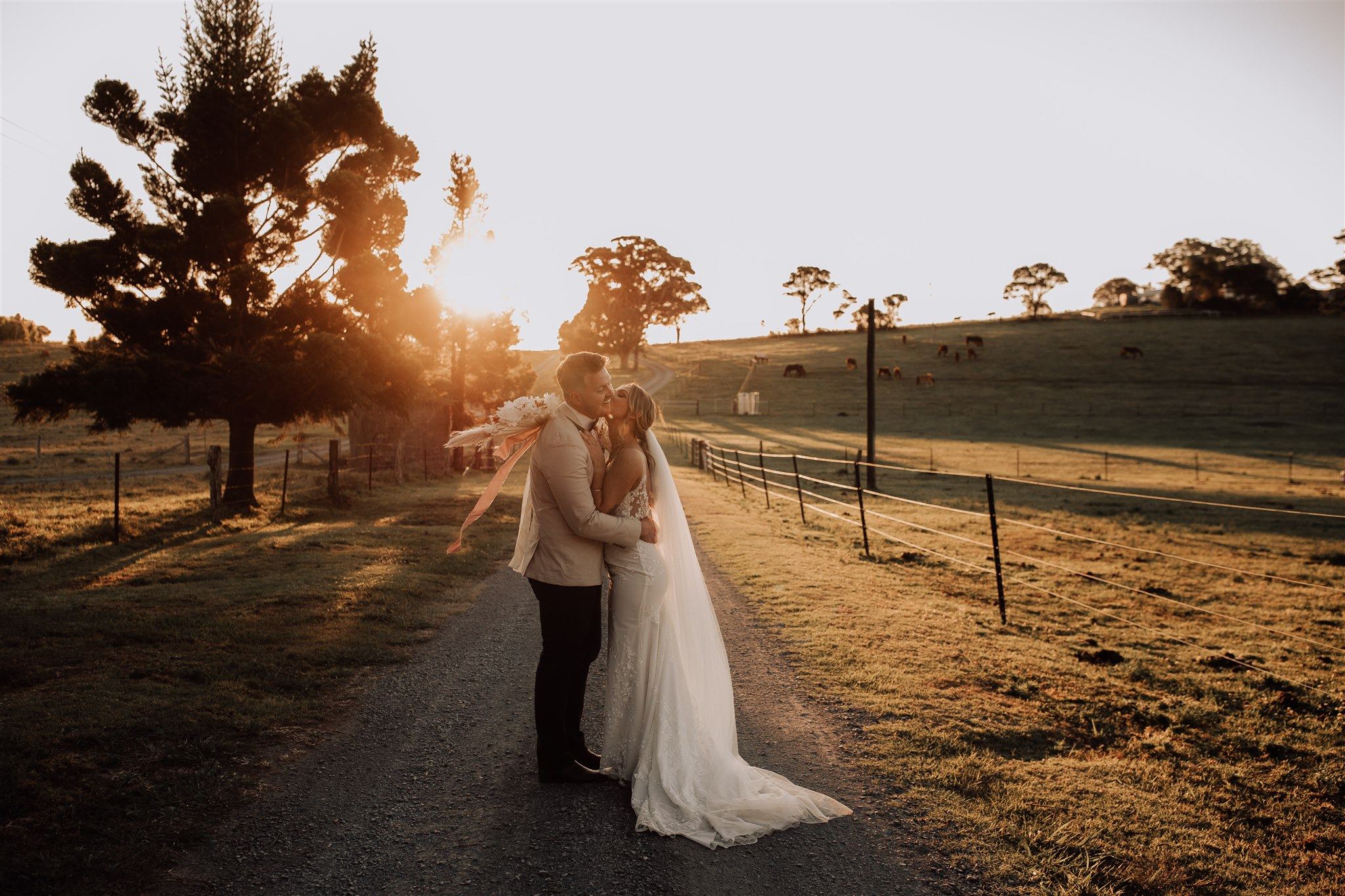 Couple on the Rosewood Estate driveway at sunset
