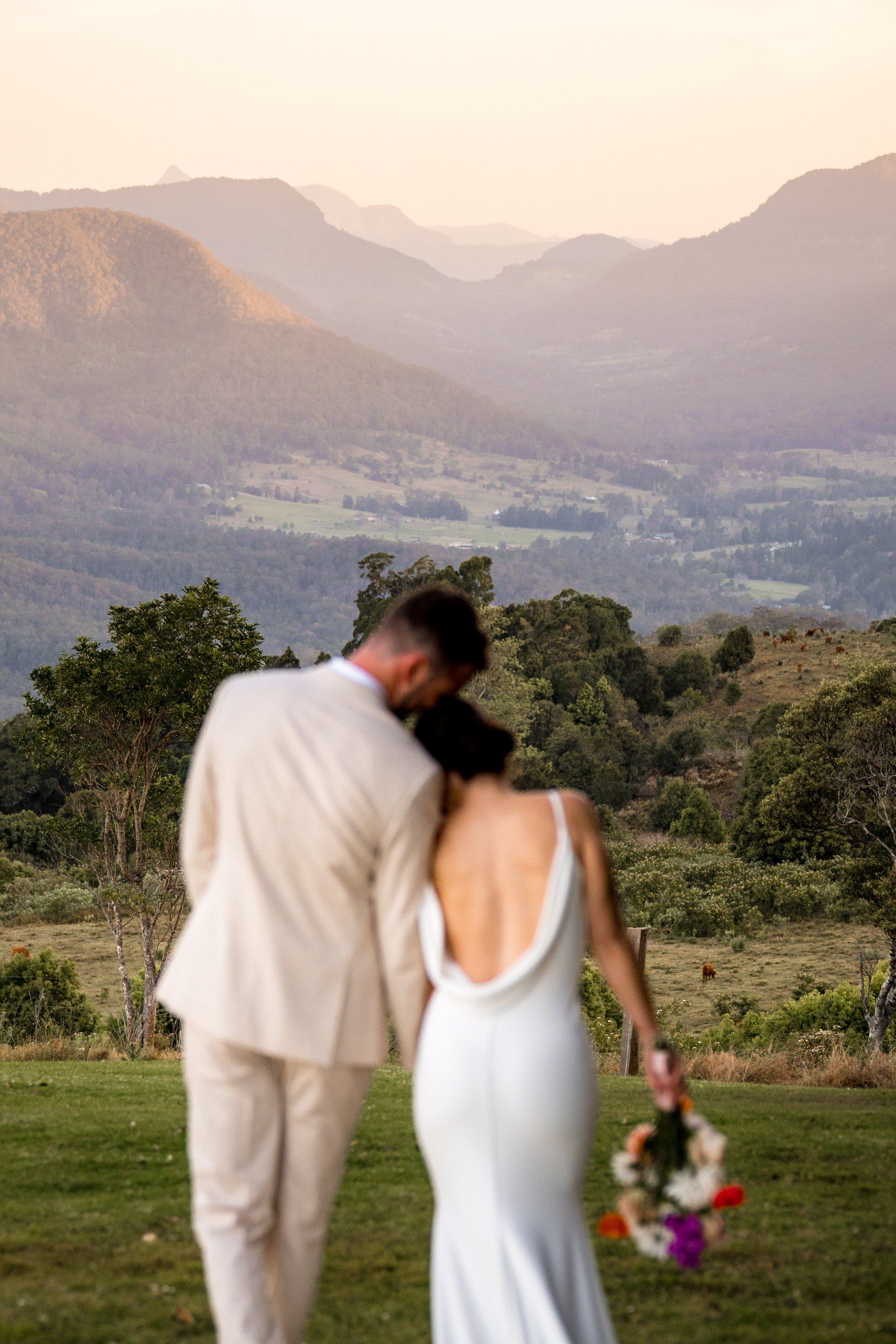 A couple embracing above the valley