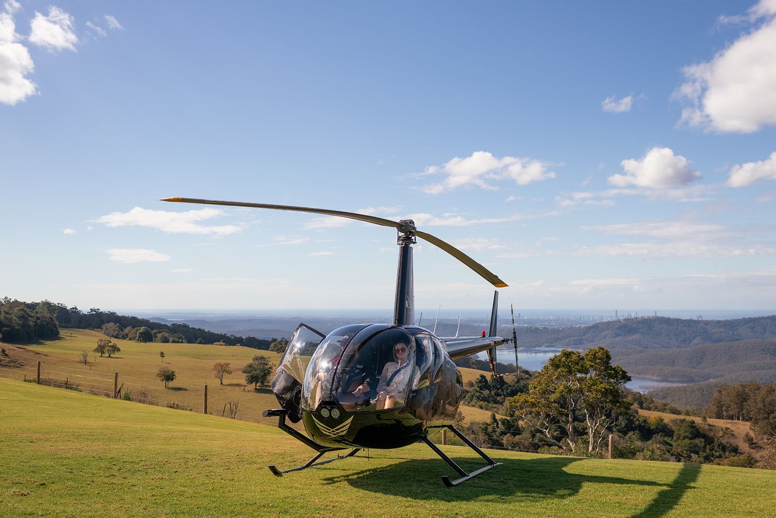 A helicopter landing on the lawn at Rosewood Estate