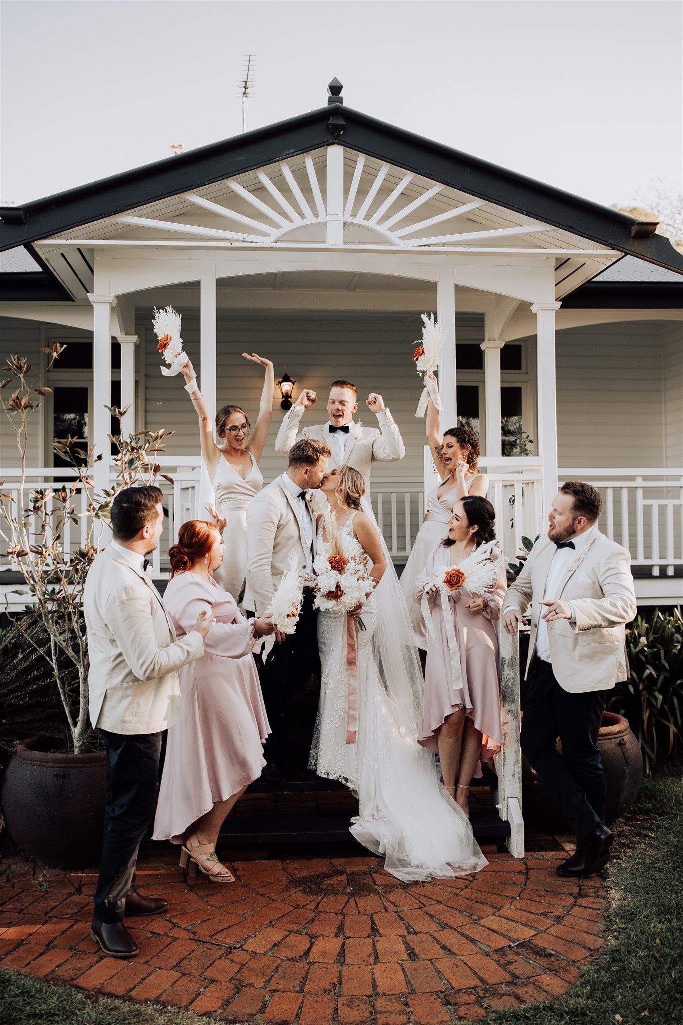 Bridal party in front of Rosewood Homestead