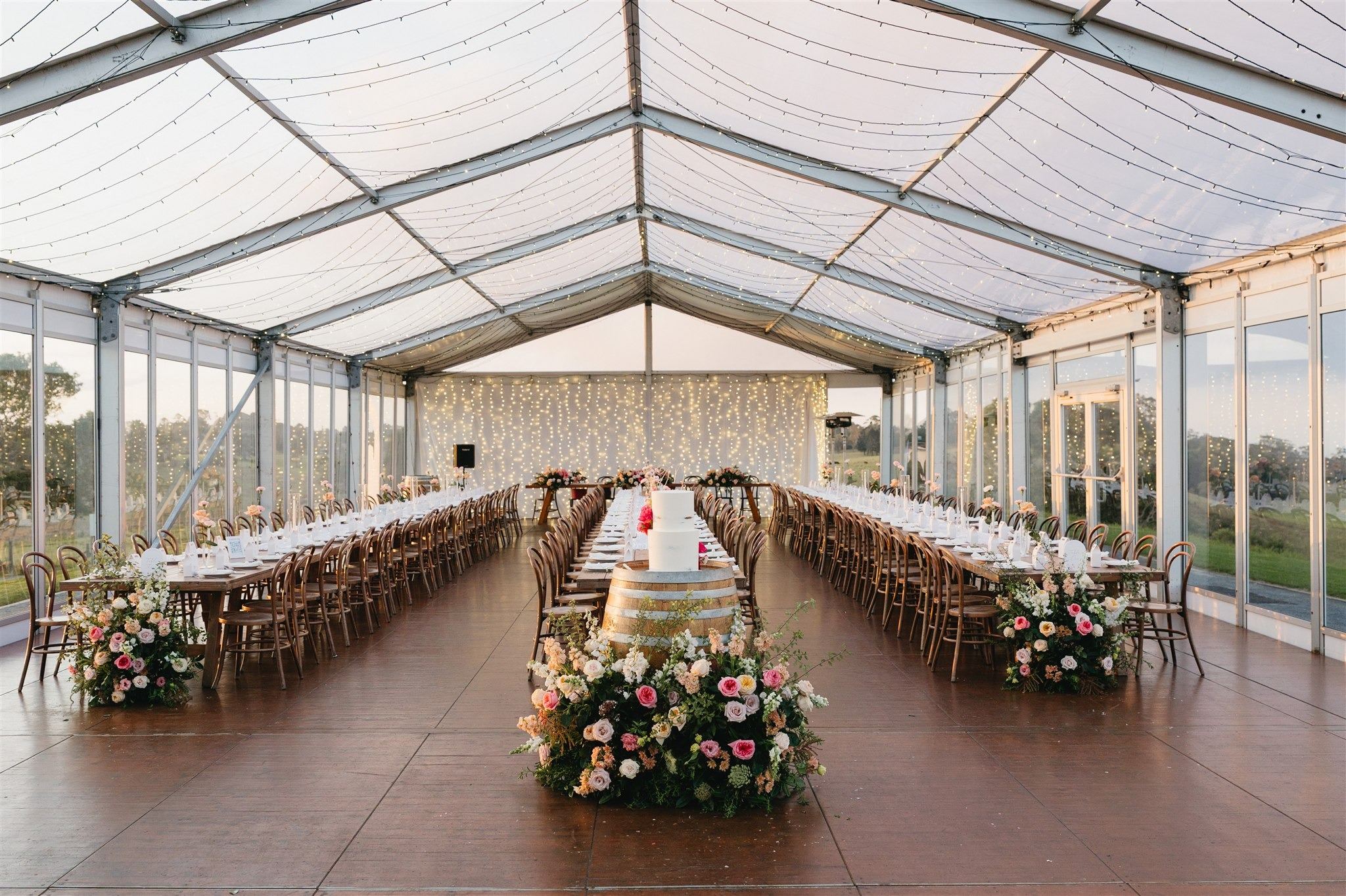 Long tables under the clear marquee roof