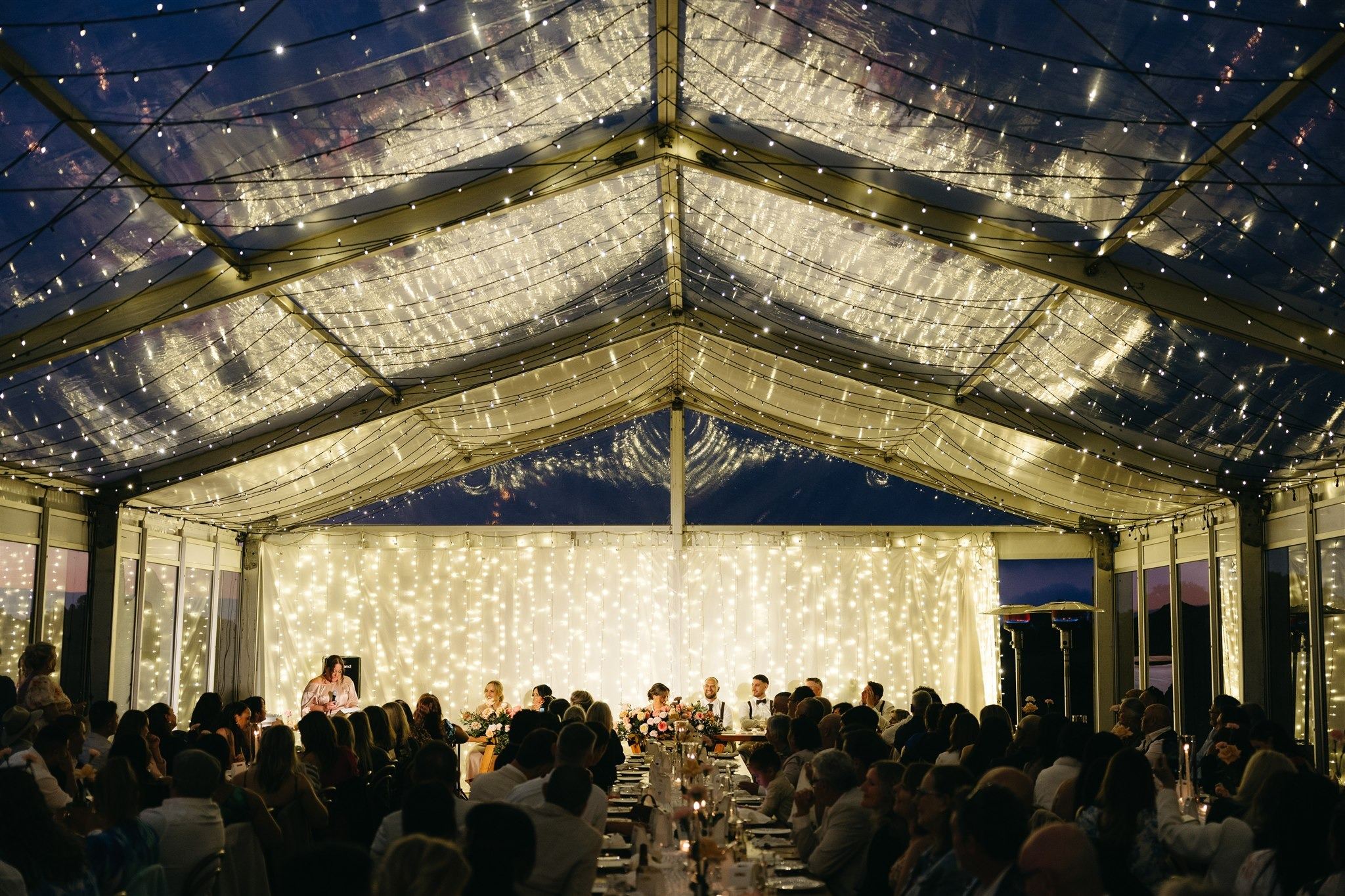 The marquee at night under a ceiling of fairy lights