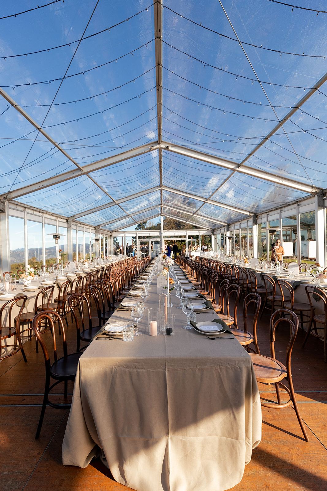 A long table set inside the marquee at Rosewood Estate