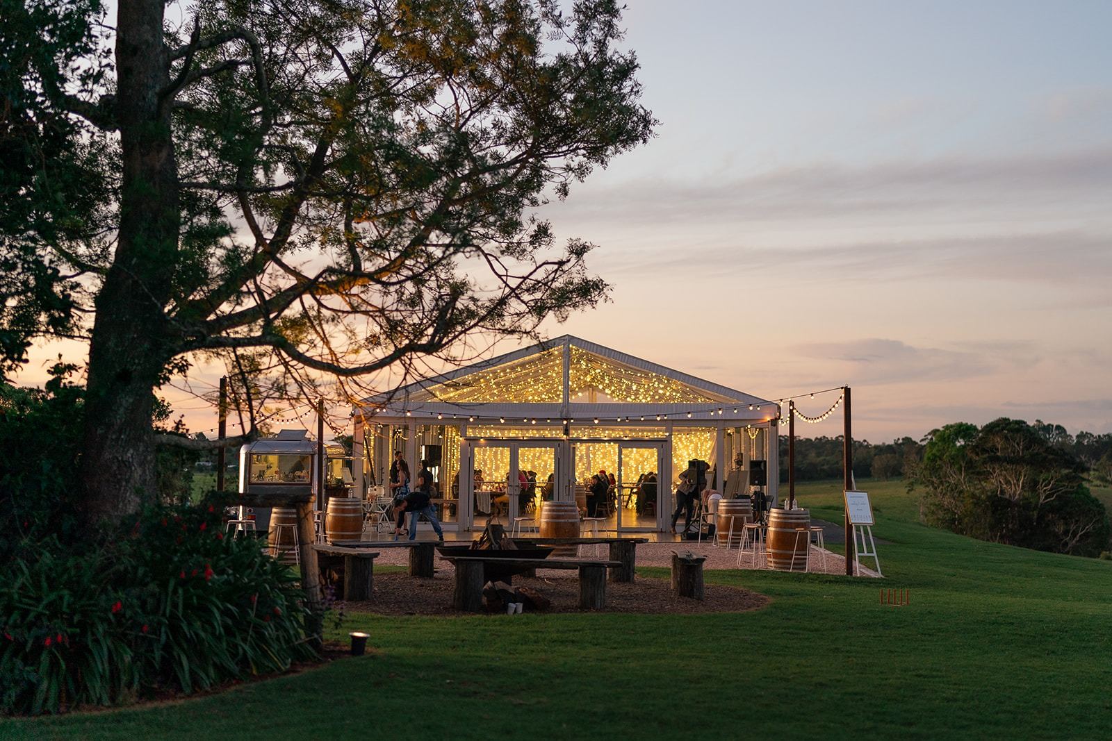 The marquee at sunset beneath the trees